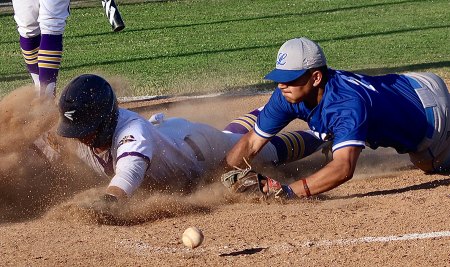 Lemoore's Israel Ramos scores as the ball rolls away from Lompoc's Andrew Aguilar in Friday's Division II playoff game in Lemoore.